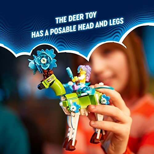 Person holding LEGO deer toy with posable head and legs.