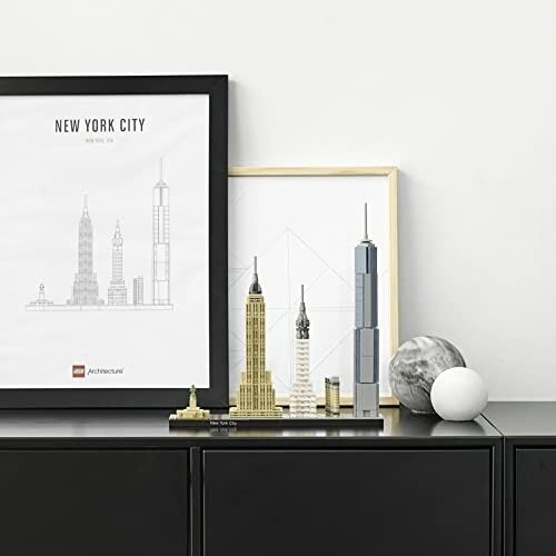 LEGO New York City skyline set on a shelf with framed prints