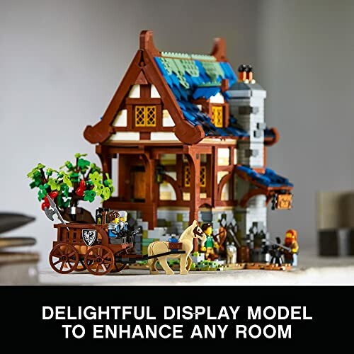 Lego medieval house display model with horse and cart.